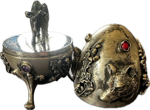 Russian silver egg featuring a wolf and a bull - 1